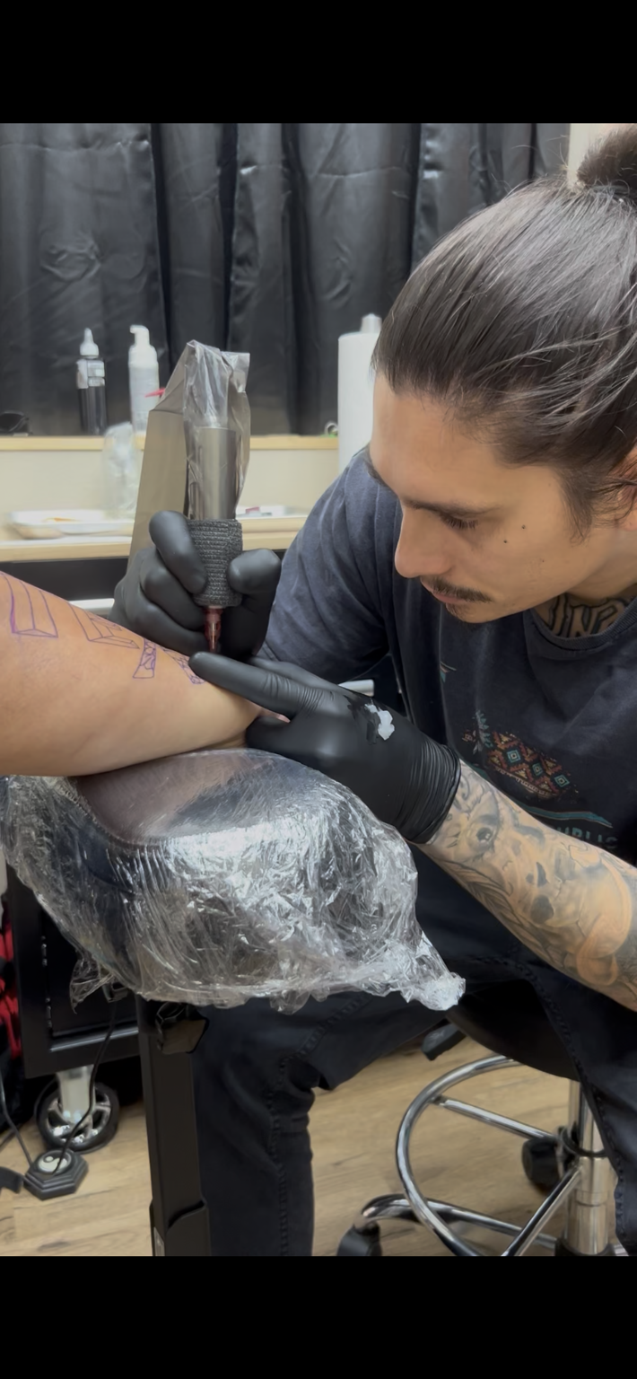 Tattoo artist at work